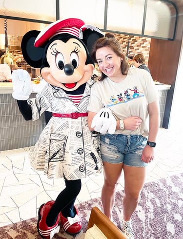 Dasee Johnson pictured with Minnie Mouse at Walt Disney World®.