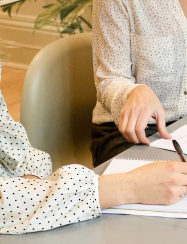 Two women sitting in a consulting and having in conversation in nutritional advice.