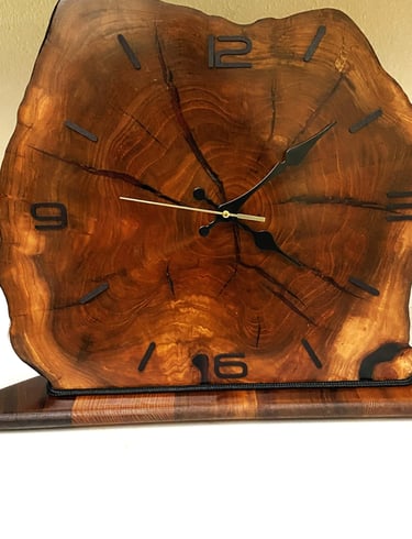 Edged wooden slab clock for table or shelf.
