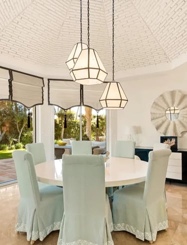 Dining space at Villa El Rincon with arched windows