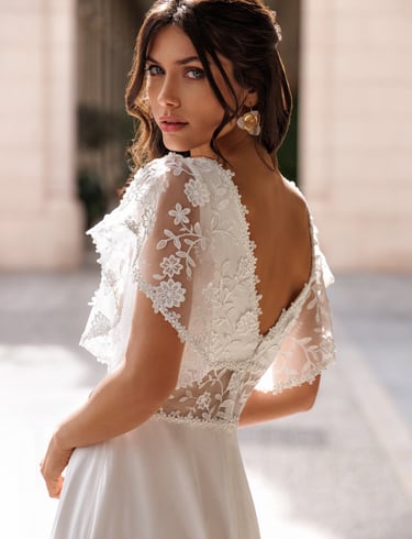 a woman in a white dress with a white dress