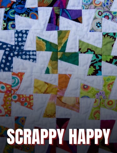 a colorful quilt with white windmills