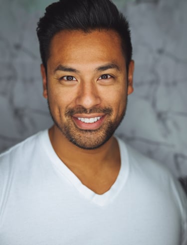 a man with a beard and a white shirt
