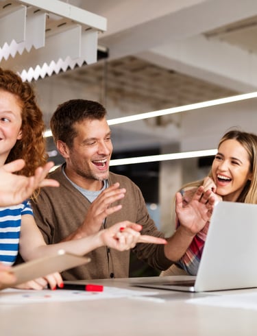 a group of people sitting around a table