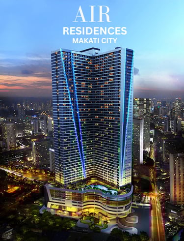 Luxury high-rise Air Residences condominium in Makati City with blue neon lighting at night.