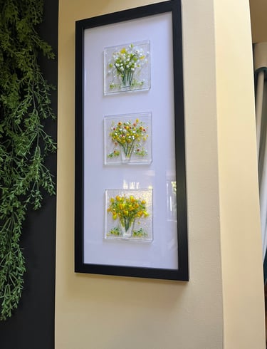 a picture of a picture of fused glass flowers