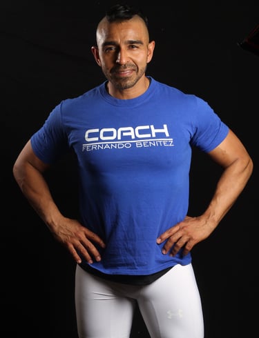 a man in a blue shirt and white pants