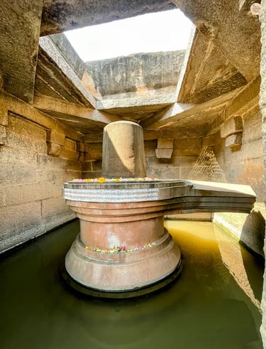 Badavalinga in Hampi, a sacred Shivalinga surrounded by water.