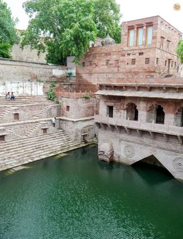 Toorji ka Jhalra stepwell in Jodhpur with intricate stone steps and glimmering water.