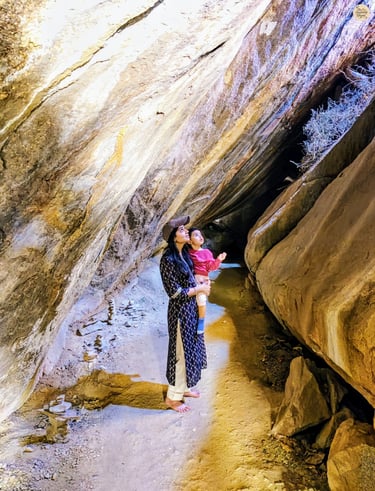 At Vali Cave in Hampi—mother and child tracing tales where legends once lived.