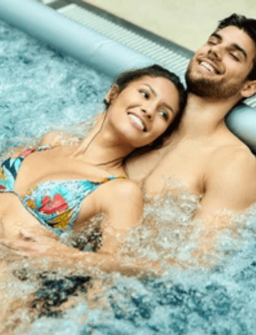 a man and woman in a hot tub