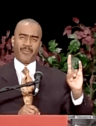 Gino Jennings of Truth of God Broadcast showing hand signs at the FCOOLJC on Sept 2 2012