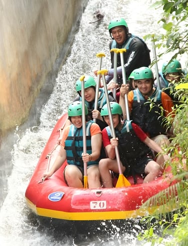 a group of people on a raft raft rafting down a river