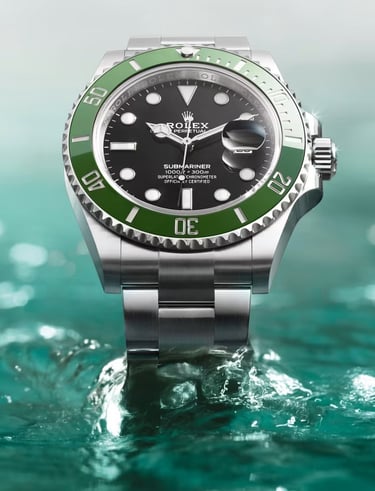 Rolex Submariner with green bezel showcased on water, highlighting luxury and precision.