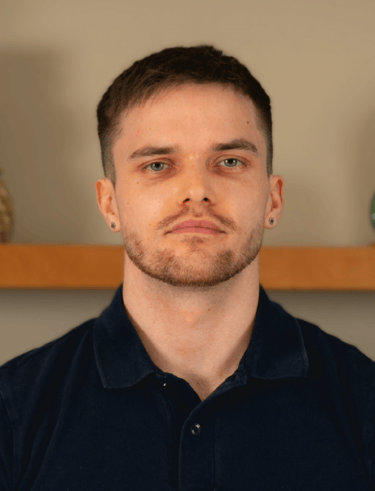 Professional headshot of TJay Harvey, qualified Level 4 sports massage therapist.