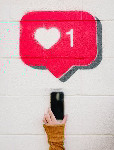 a person holding a cell phone up to a wall