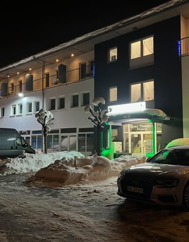 a car parked in front of Hotel Thannhof with Parking place from Hotel Thannhof entry