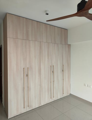 alt="Custom BWP plywood wardrobes in master bedroom by Integrity Enterprise"