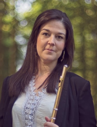 a woman in a black jacket and a woman in a white top