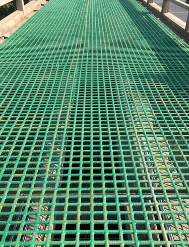 GFRP rebars integrated into a large-scale bridge construction site under bright daylight.