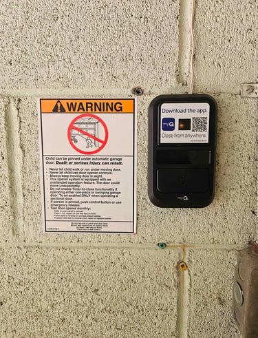 MyQ pad installed with warning sticker.