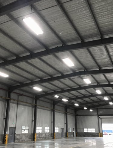 Close-up of an electrician testing electrical panels with professional tools.