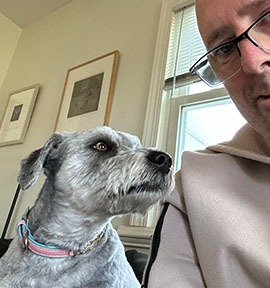 Portait of the dog with the dog watcher