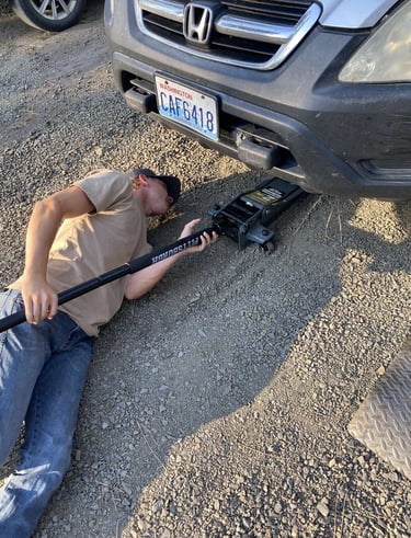 Our technician jacking up a car
