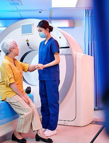 Technician guiding a patient before MRI scan in a Delhi diagnostic center.