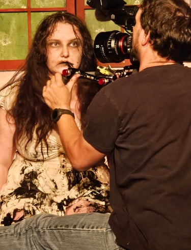 Delaney Harrington sits for a closeup. BTS 2024 Proscenium Crossed