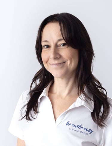 a cleaning professional smiling