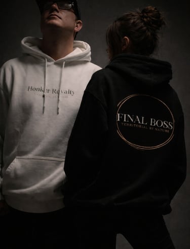 a man and woman wearing Honker Royalty OG First Snow Fall Hoodie and The Final Boss Hoodie