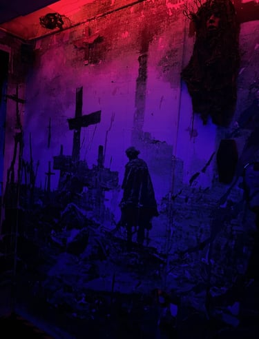 Dark gothic wall art mural with crosses and a silhouette under red and purple neon lighting.