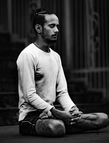A man meditates in lotus pose