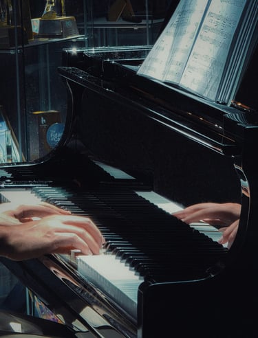 Close-up of a pianist's hands playing a black grand piano with sheet music in a dimly lit setting.