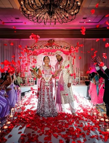omantic mandap setup with pastel flowers and drapes by Amika Weddings and Events in Pune