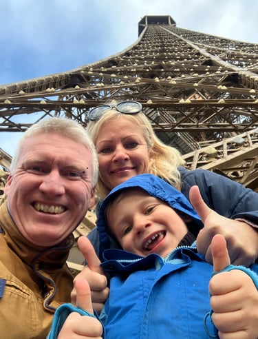 Family at the base of the Eiffel Tower