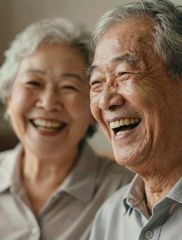 A close up of an elderly couple laughing, high detail on facial expressions, warm cinematic lighting, authentic feeling of joy and connection.