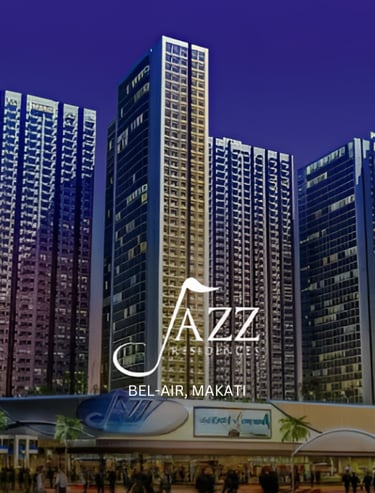Luxury high-rise Jazz Residences condo towers at night in Bel-Air, Makati CBD.