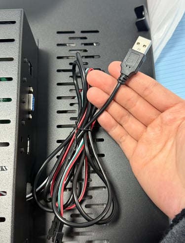 ClaraTech Halo monitor back panel showing USB interface for SDK synchronization and protocol control.