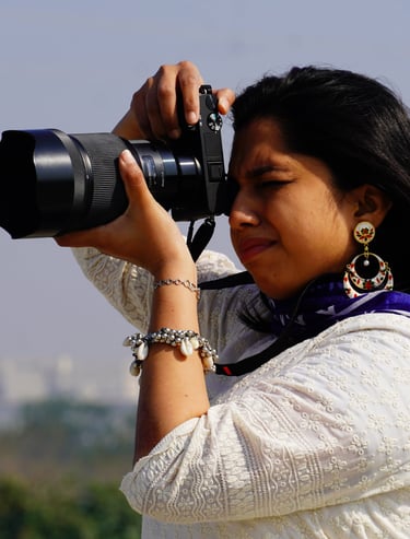 a woman in a white shirt and blue scarf