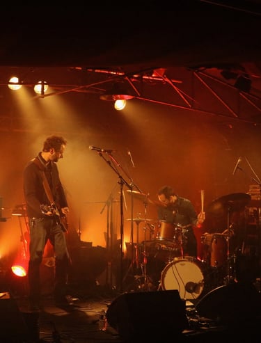 a band playing on stage with Dorian Chamoin