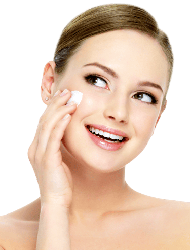 Smiling woman applying facial cream for radiant skin, promoting beauty and skincare routines.