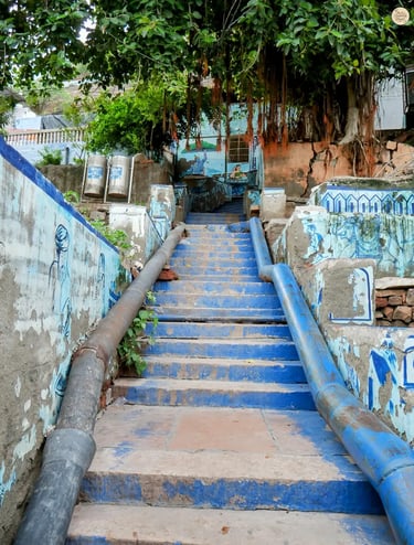 Blue Corridor stairs decorated with Rajasthani wall art, leading up to Pachetia Hill viewpoint, Jodhpur