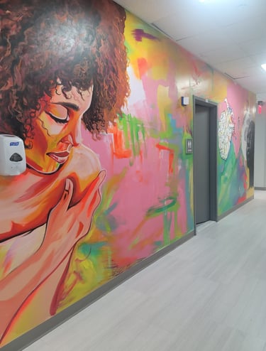 A woman looking over her shoulder painted on the previously blank wall.