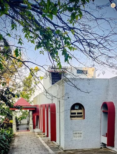 Gandhi Nilaya, a colonial-era bungalow turned heritage guest house at Nandi Hills, surrounded by lush gardens and hill views