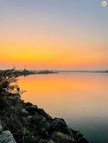 Sunset at Kamalapur Lake—Hampi’s sky blushed in pink serenity.