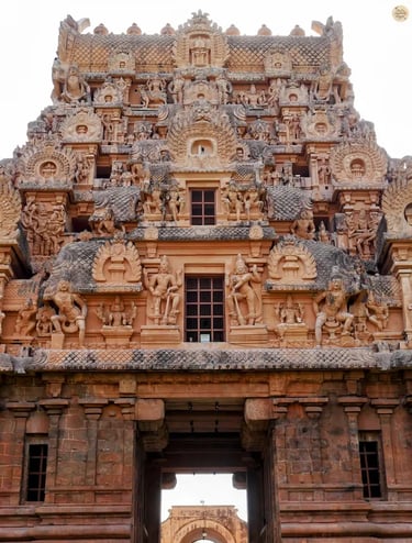 Ancient Chola stone carvings of figures at the entrance of Brihadeeswara Temple