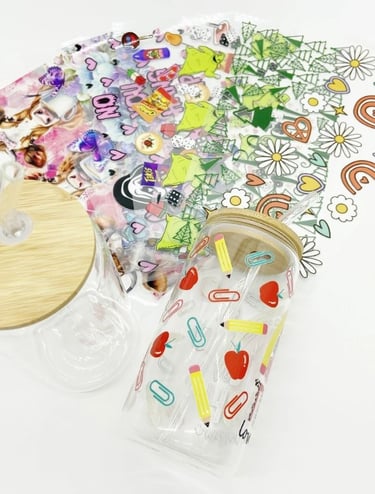 bunch of DTV UV stickers and 2 Soda jar with 1 full decorated stickers