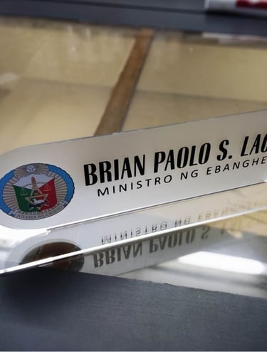 Frosted acrylic desk nameplate with church emblem.